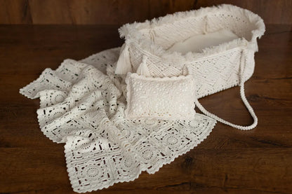 White lace bag and blanket on a wooden surface